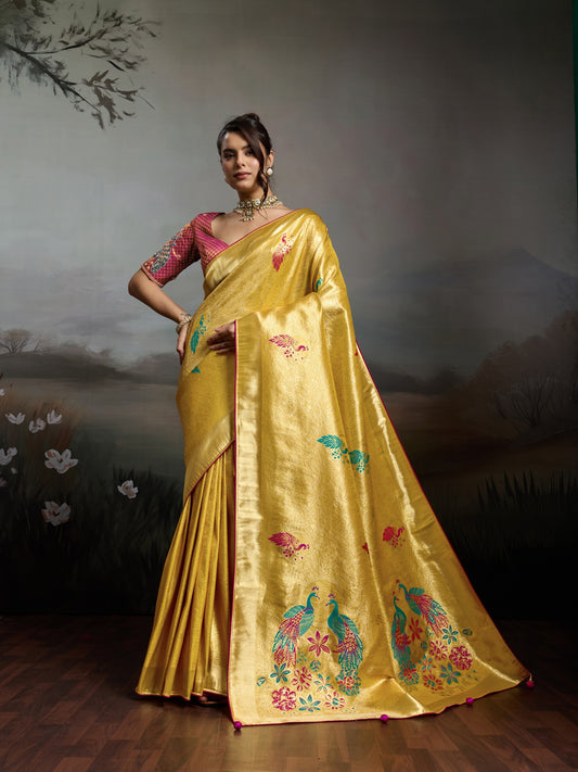 Woman wearing yellow banarasi silk saree with woven motif design and magenta blouse