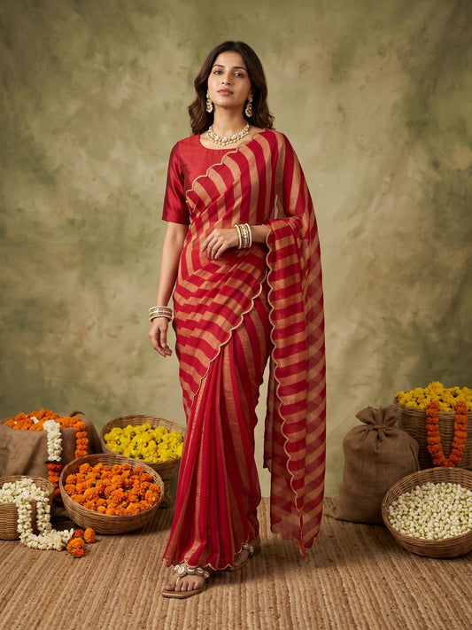 Woman wearing red paper silk saree with striped pattern design and red blouse