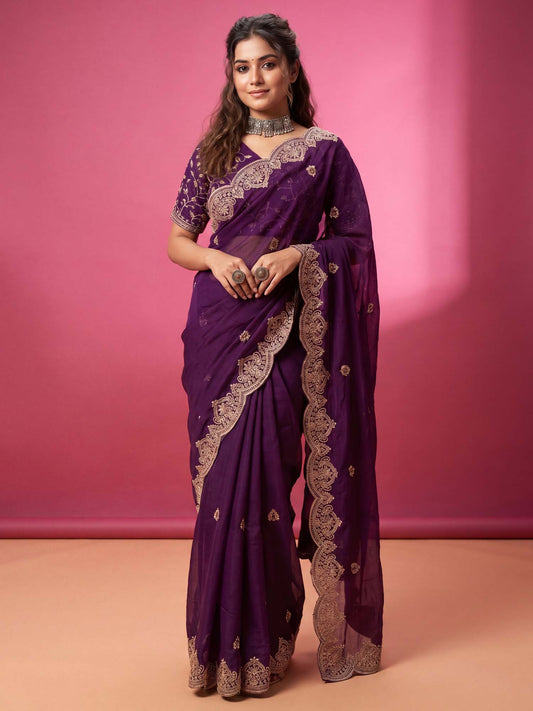 Woman wearing purple georgette saree with embroidered motif work and purple blouse