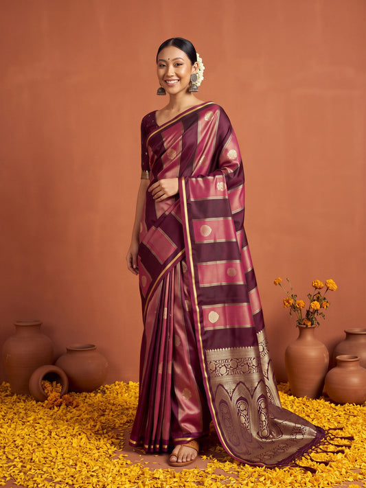 Woman wearing wine satin saree with traditional indian motif work and wine blouse