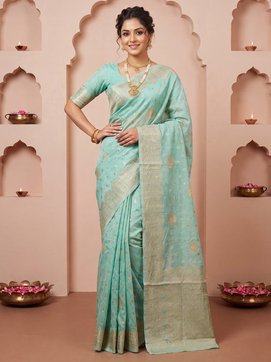 Woman wearing light blue silk blend saree with zari butta (metallic motif) work and light blue blouse