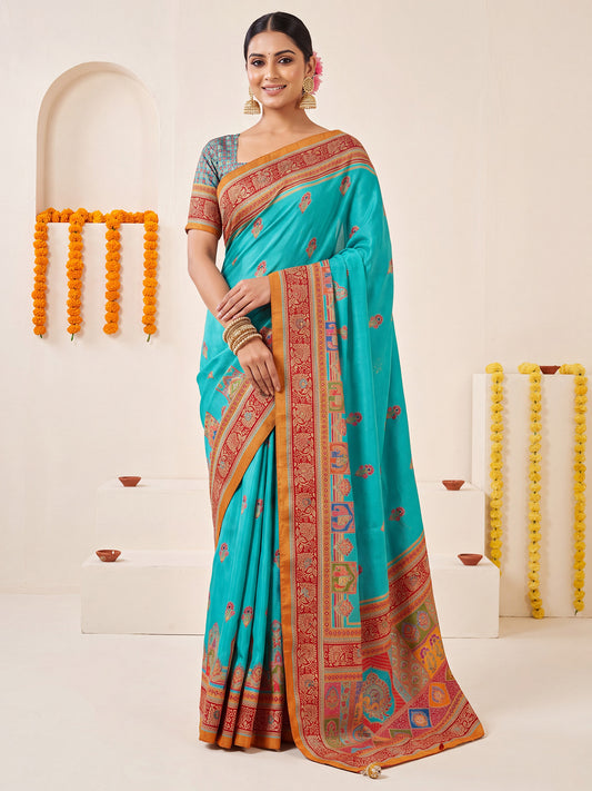 Woman wearing turquoise blue silk blend saree with kalamkari narrative motif work and turquoise blue blouse
