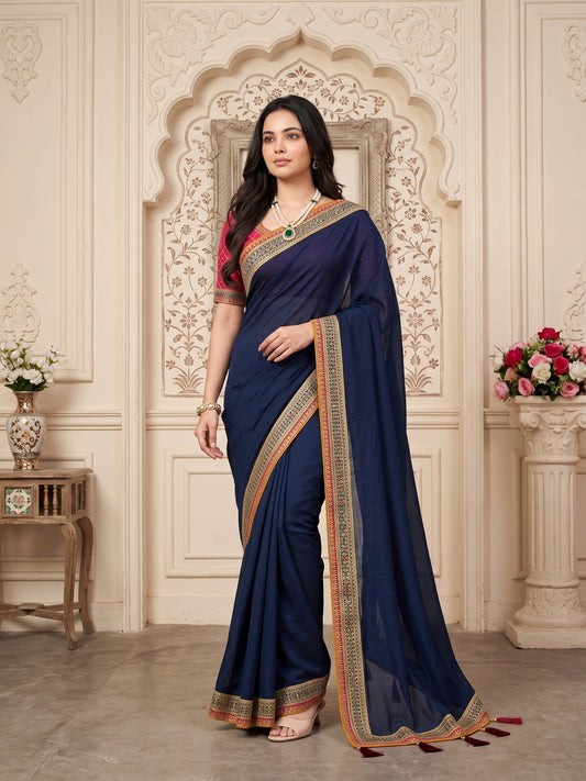 Woman wearing teal blue vichitra silk saree with clean solid-tone finish and maroon blouse