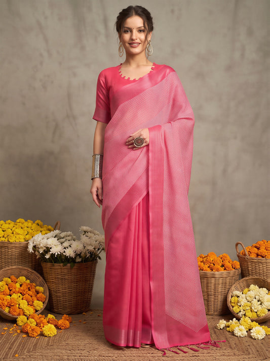 Woman wearing pink linen saree with striped pattern design and pink blouse