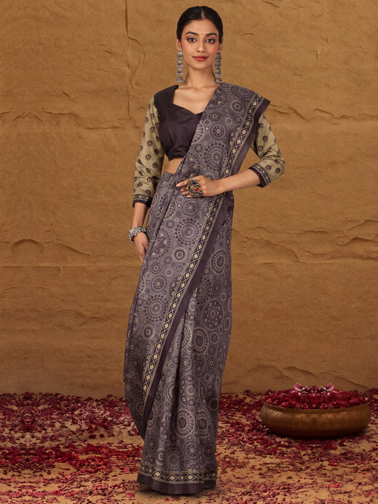 Woman wearing grey silk blend saree with ajrak block-print motif work and brown blouse