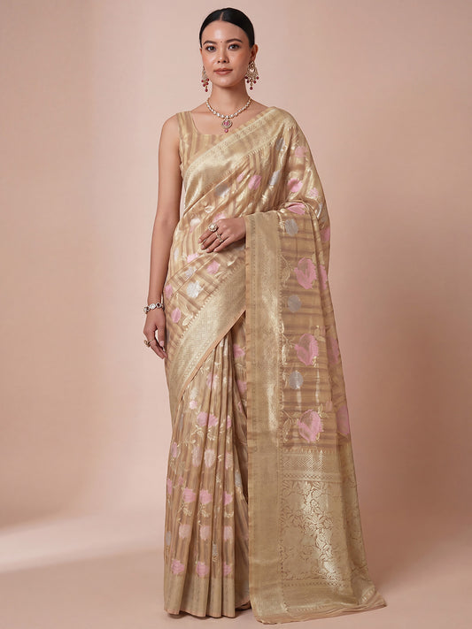 Woman wearing beige silk blend saree with all-over floral design and beige blouse