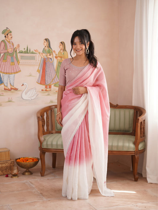 Woman wearing pink paper silk saree with ombre graded colour work and pink blouse