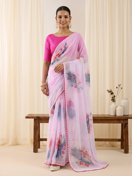 Woman wearing lavender georgette saree with metallic foil print work and pink blouse