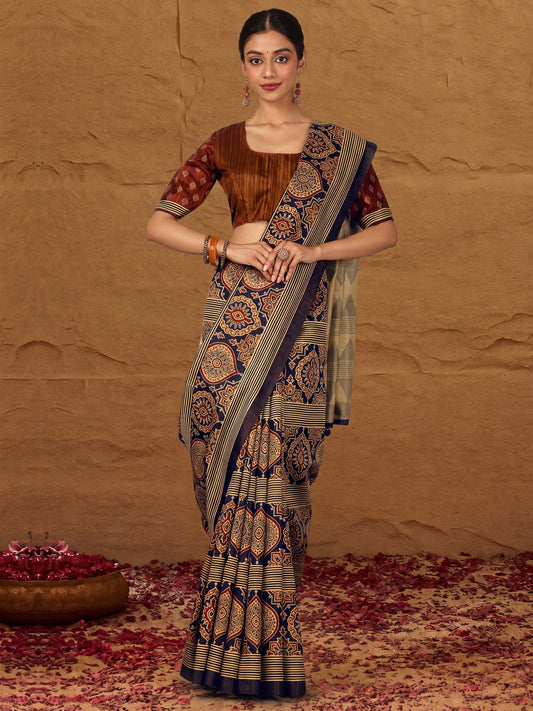 Woman wearing navy blue silk blend saree with traditional indian motif work and camel brown blouse
