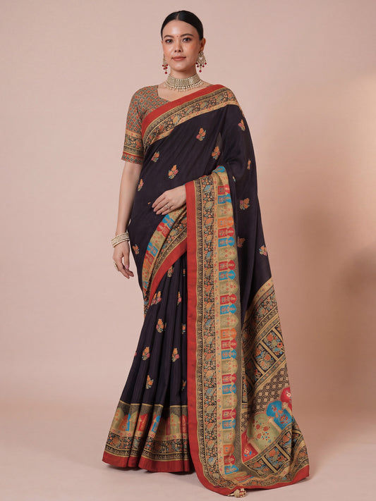 Woman wearing black silk blend saree with kalamkari narrative motif work and multicolored blouse