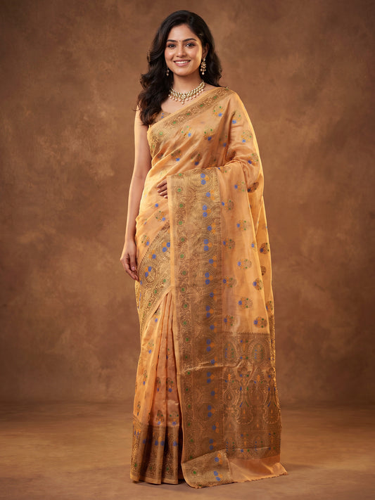 Woman wearing orange silk blend saree with zari butta (metallic motif) work and orange blouse