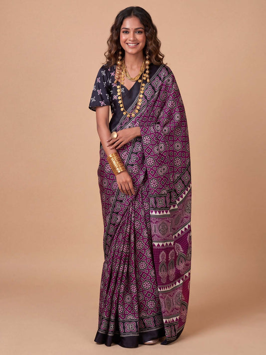 Woman wearing purple crepe saree with ajrak block-print motif work and black blouse