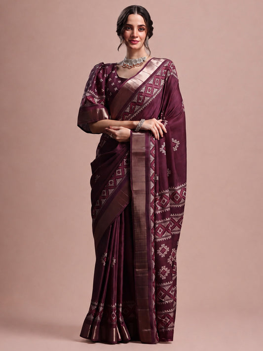 Woman wearing magenta silk blend saree with geometric pattern design and magenta blouse