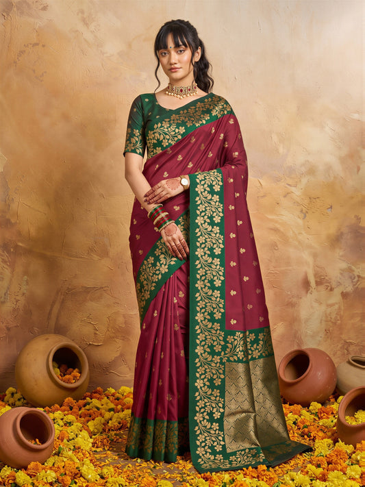 Woman wearing maroon cotton blend saree with all-over floral design and green blouse