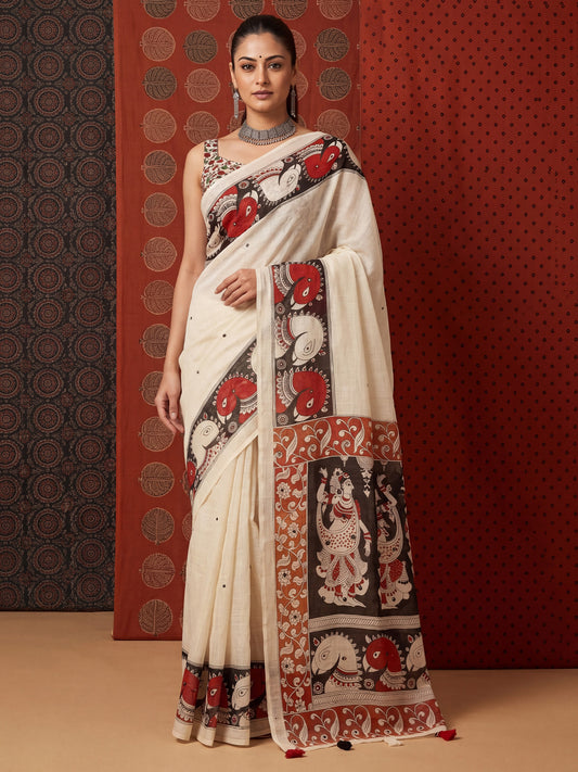 Woman wearing off white linen saree with madhubani folk-art motifs and off white blouse