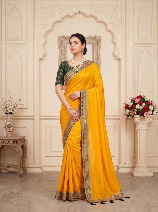 Woman wearing mustard vichitra silk saree with clean solid-tone finish and green blouse