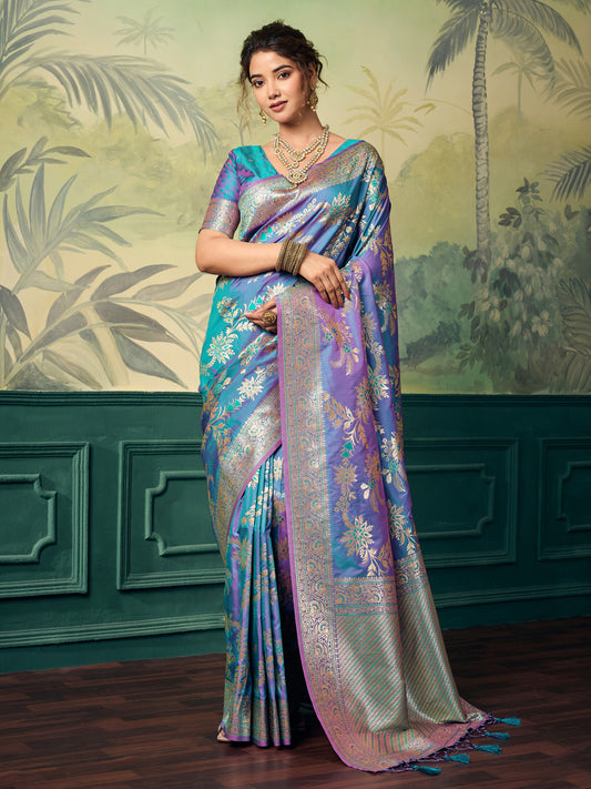 Woman wearing teal blue banarasi silk saree with woven motif design and teal blue blouse