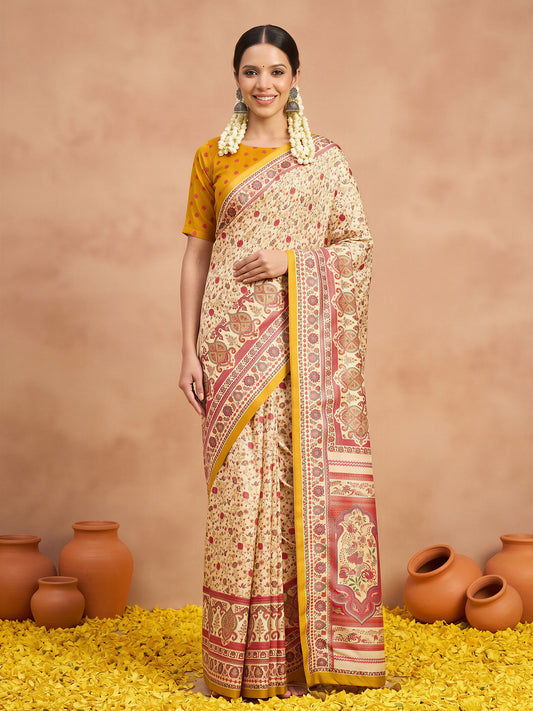 Woman wearing cream silk blend saree with metallic foil print work and yellow blouse
