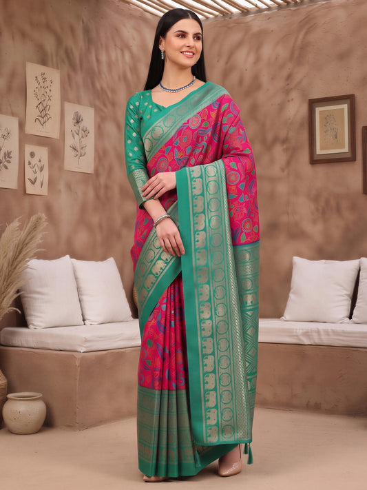 Woman wearing pink cotton blend saree with botanical floral and leaf design and teal blue blouse