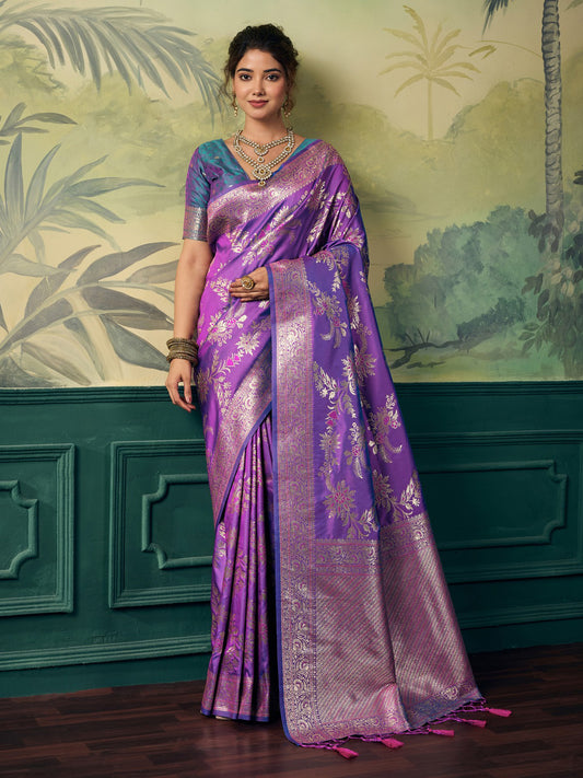 Woman wearing lavender banarasi silk saree with woven motif design and teal blue blouse