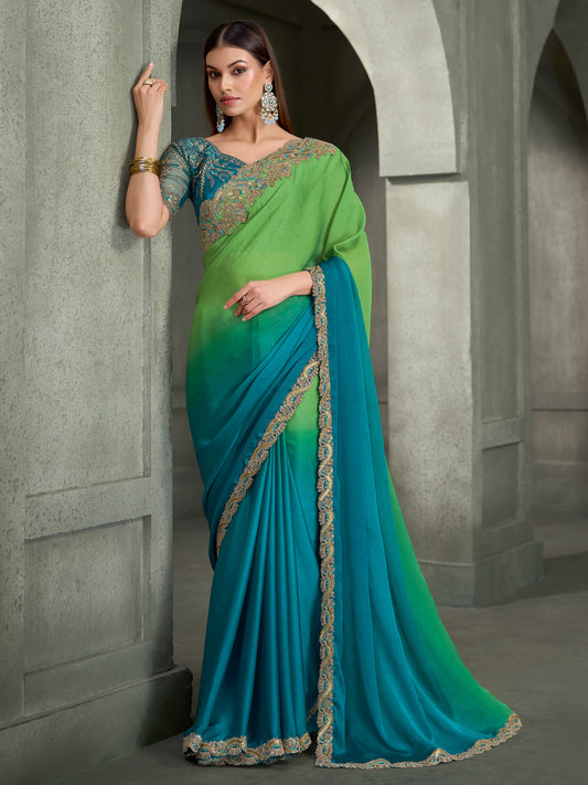 Woman wearing light green chiffon saree with ombre graded colour work and blue blouse