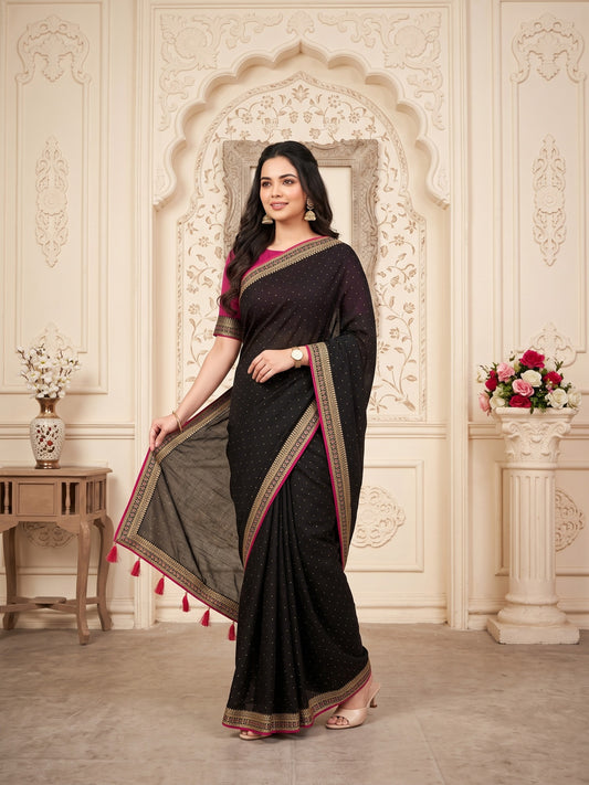 Woman wearing black vichitra silk saree with ornamented surface design and pink blouse