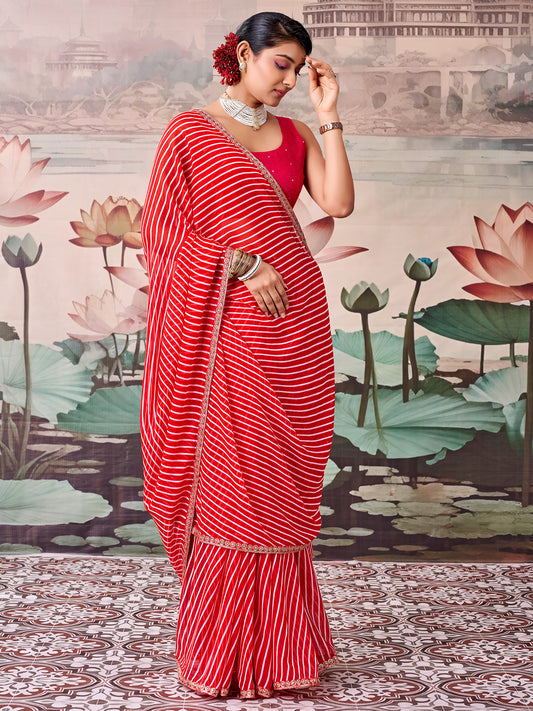 Woman wearing red georgette saree with striped pattern design and red blouse