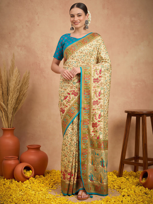 Woman wearing cream silk blend saree with metallic foil print work and light blue blouse