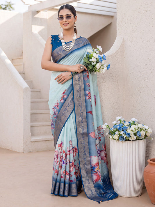 Woman wearing light blue viscose silk saree with all-over floral design and blue blouse