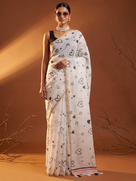 Woman wearing white cotton linen saree with quirky design and black blouse