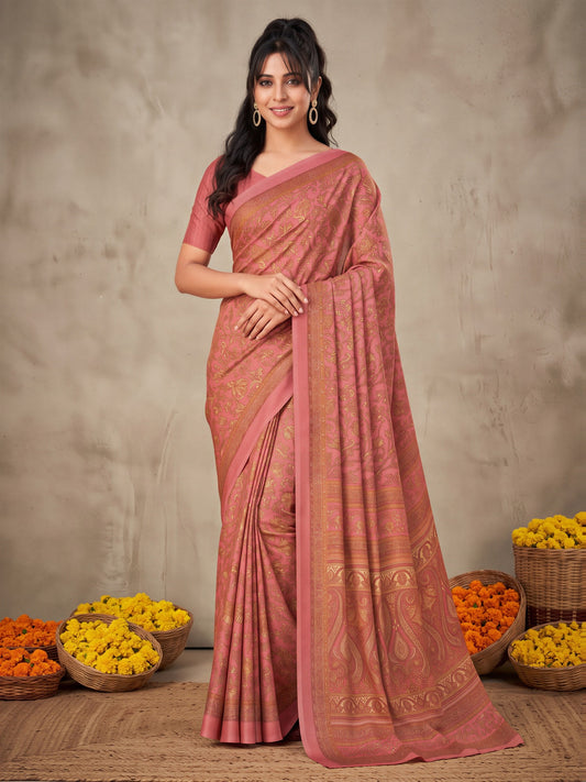 Woman wearing peach crepe saree with traditional indian motif work and peach blouse