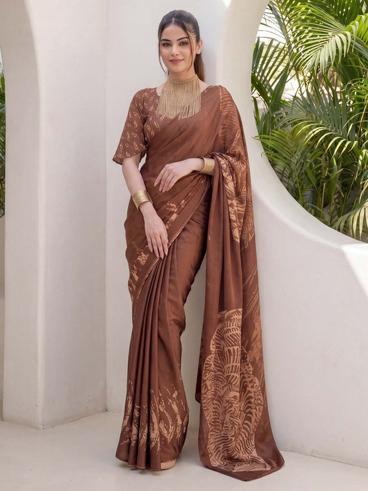 Woman wearing brown crepe saree with abstract contemporary design and brown blouse