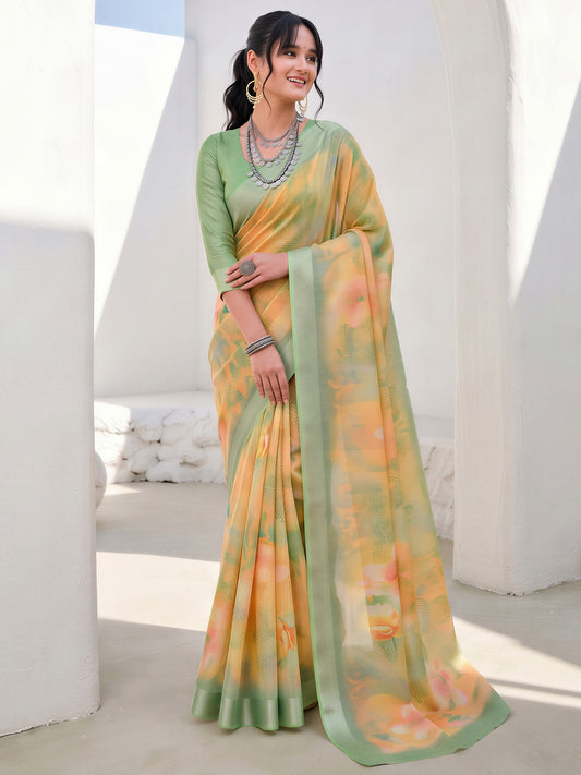 Woman wearing yellow cotton linen saree with traditional indian motif work and sea green blouse