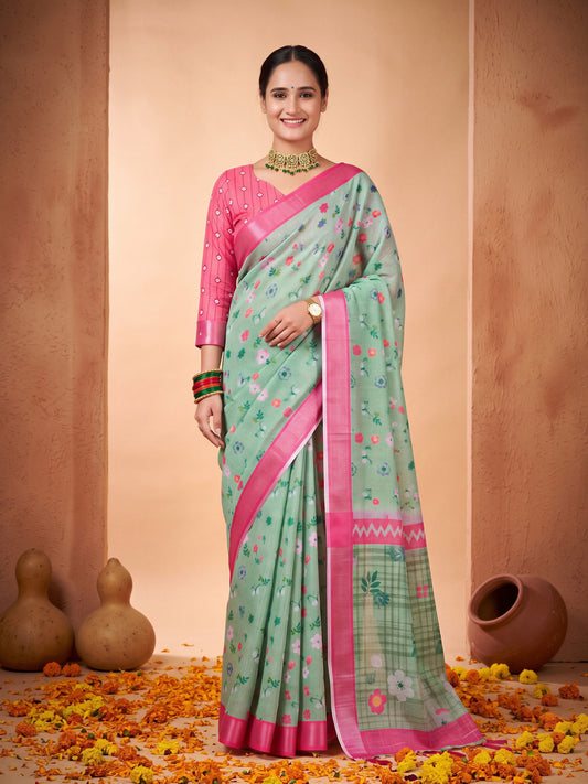 Woman wearing sea green cotton linen saree with all-over floral design and pink blouse