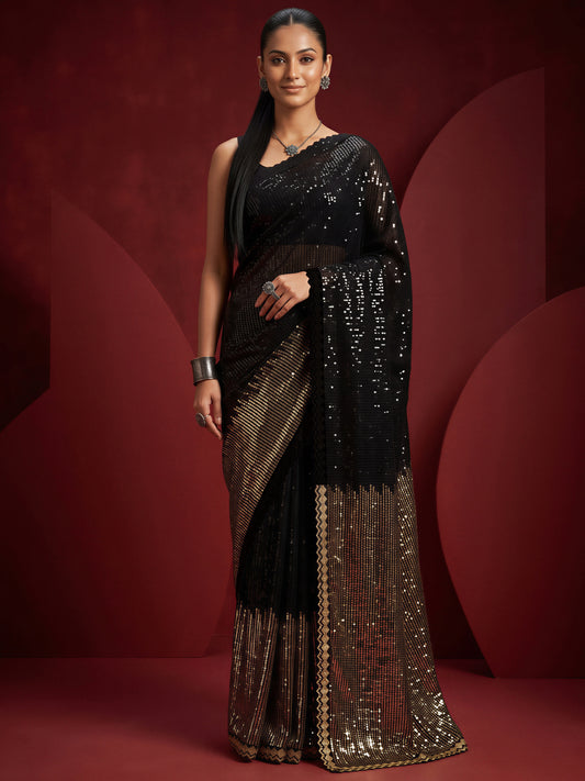Woman wearing black pure georgette saree with ornamented surface design and black blouse