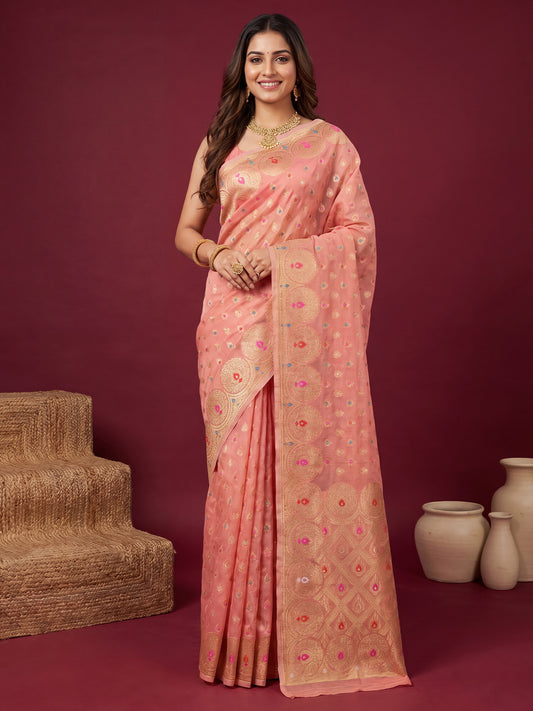 Woman wearing pink silk blend saree with zari butta (metallic motif) work and pink blouse