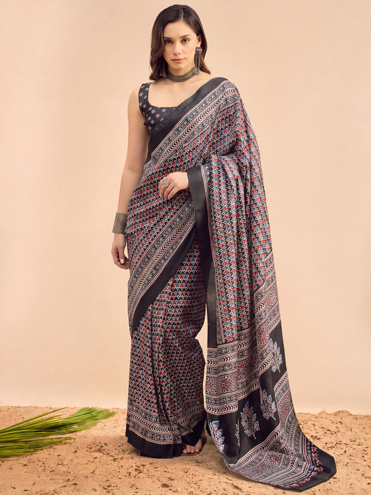 Woman wearing black dola silk saree with woven motif design and black blouse