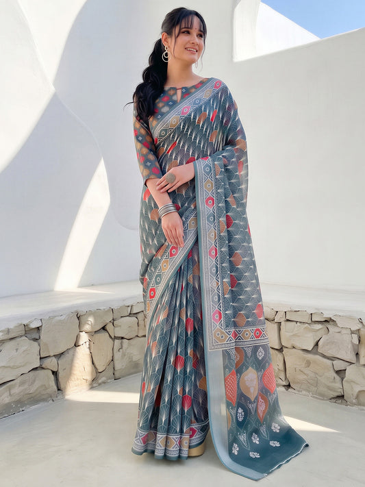 Woman wearing sea green cotton linen saree with traditional indian motif work and sea green blouse