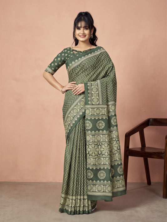 Woman wearing green dola silk saree with geometric pattern design and green blouse