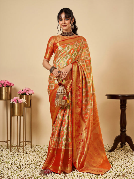 Woman wearing orange silk blend saree with traditional indian motif work and orange blouse