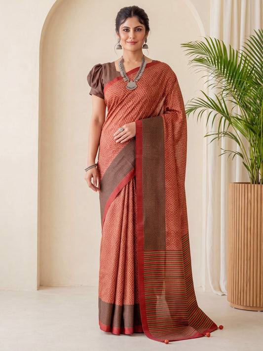 Woman wearing rust silk blend saree with geometric pattern design and brown blouse