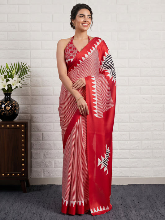 Woman wearing red satin silk saree with striped pattern design and red blouse