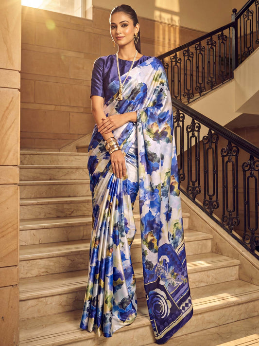 Woman wearing off white satin silk saree with abstract contemporary design and navy blue blouse