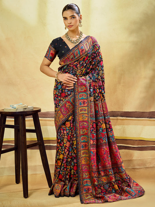 Woman wearing black muga cotton saree with traditional indian motif work and black blouse