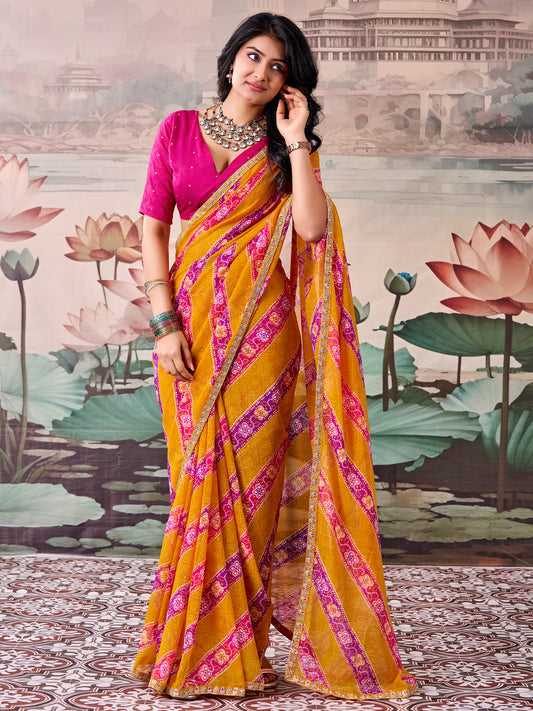Woman wearing mustard georgette saree with bandhani tie-dye dot work and pink blouse