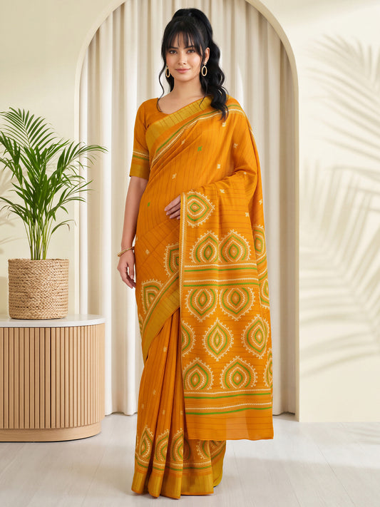 Woman wearing mustard silk blend saree with traditional indian motif work and mustard blouse