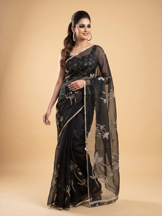 Woman wearing black organza saree with abstract contemporary design and black blouse