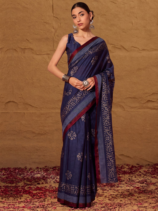 Woman wearing indigo cotton saree with batik wax-resist design and indigo blouse
