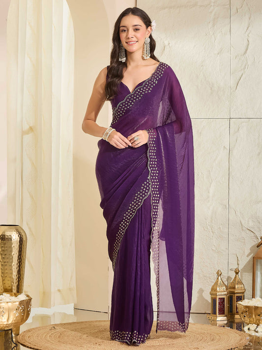 Woman wearing purple satin saree with clean solid-tone finish and purple blouse