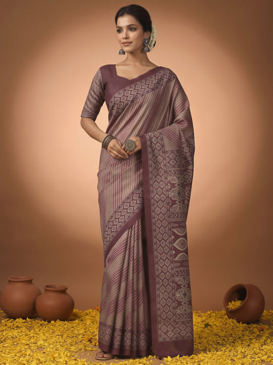 Woman wearing mauve silk blend saree with striped pattern design and mauve blouse